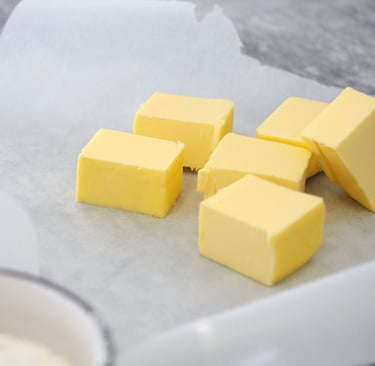 a bunch of butter butter cubes on a table