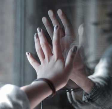 a person holding their hands up to a person's hand