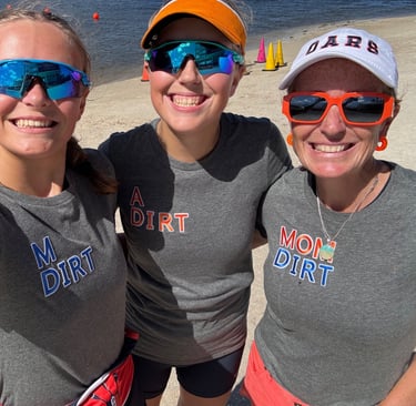 M Dirt, A Dirt and Mom Dirt celebrating at the finish line beach