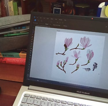 laptop showing floral art design in process