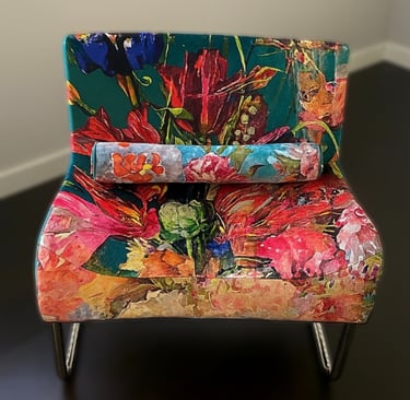 newly reupholstered modern chair with vibrant floral velvet fabric