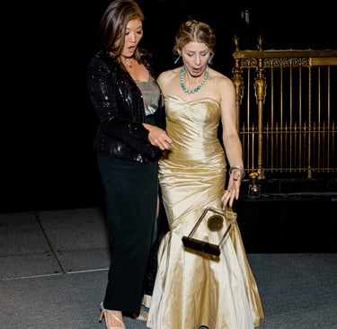 Sea Stachura and host watch as plaque falls.