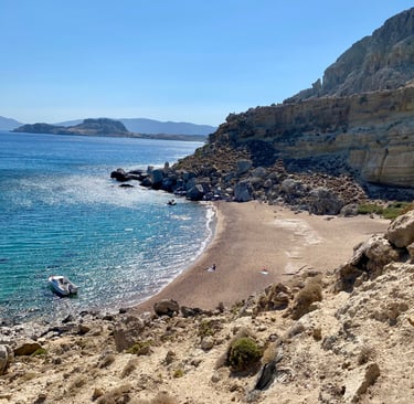a beach with a boat in the water