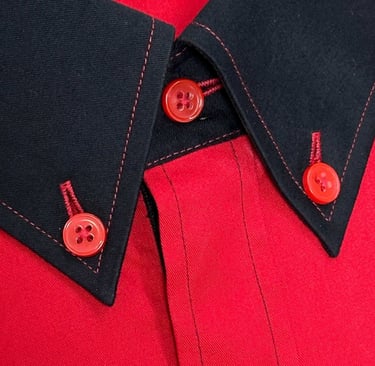 a red shirt with black and red buttons