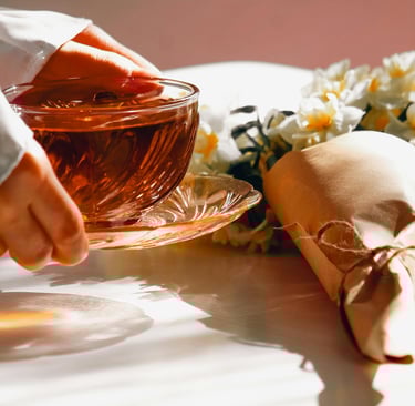 hands holding a cup of tea