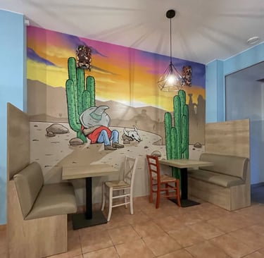 mural de un mexicano durmiendo en una pared de un restaurante mexicano