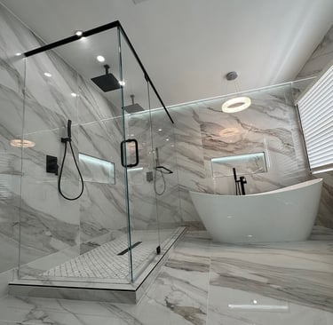 Luxurious glass shower and bathtub with marble walls – SparkEaseCleaning deep cleaning and detailing