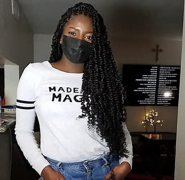 a woman with long black passion twist hairstyle