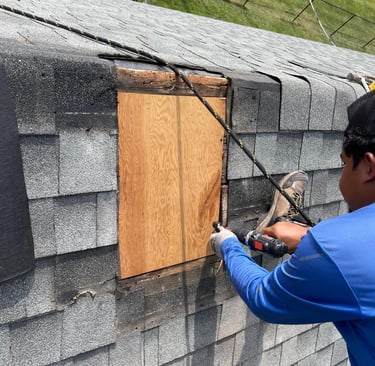 company working on a roof patch Des moines