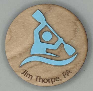 laser engraved and painted wooden souvenir magnet showing kayaker