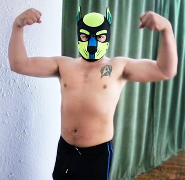 Man flexing for a pose in his pup mask.