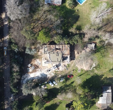 a house with a large house in the middle of a yard