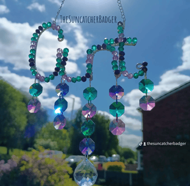 A deep ocean inspired cunt suncatcher called The Sea Witch