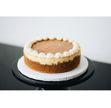 a cheesecake with a frosting on top