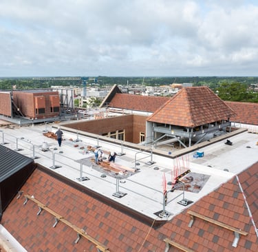 Workers replacing a roof