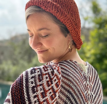 Sophie wearing her shawl in hand-dyed eco-friendly yarn