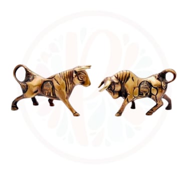 two wooden sculptures of a bull and a tiger