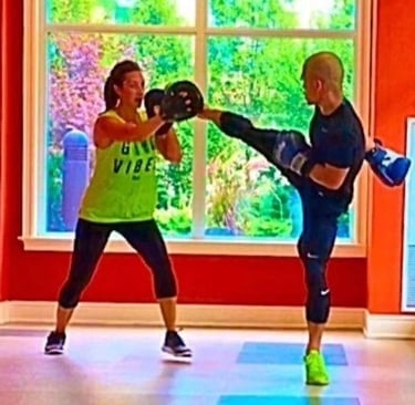 A man and woman doing JEET KUNE DO NORTH YORK PERSONAL TRAINING!