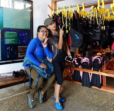 2 girls prepare for diving posing for a picture