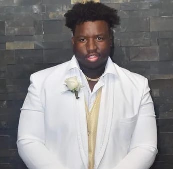 Calvin Avery dressed up for his senior prom, high school All American, Univ. of Illinois' DT 