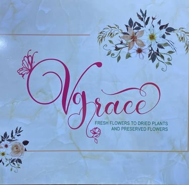 VGrace floral shop sign with marble background, offering fresh to preserved flowers.