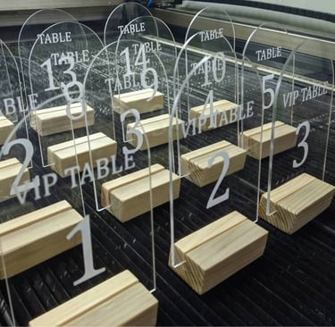 Array of clear Acrylic Table Numbers with bold black script for tables 1 through 5 and VIP precision