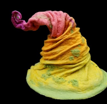a yellow and pink colored wool felt hat with a pink and yellow hat
