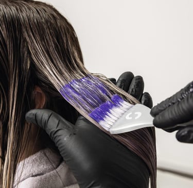 a woman is shown in a salon while her hair is dyed out