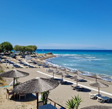 a beach with umbrellas and umbrellas on the beach