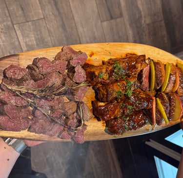 a person holding a large wooden board with steak steak and potatoes