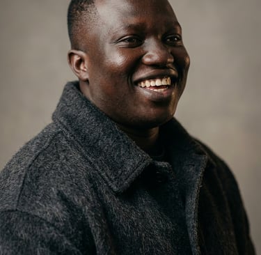 a man in a black jacket and a white shirt