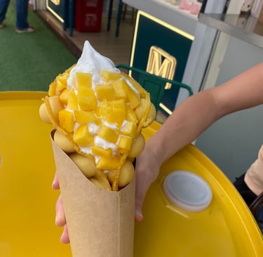 bubble waffle in shnaghai filled with mango and ice cream