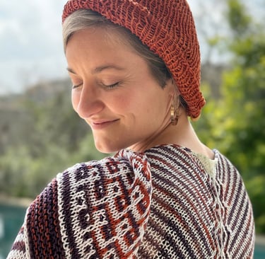Sophie wearing her shawl in hand-dyed eco-friendly yarn