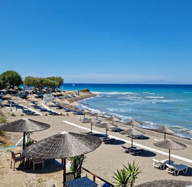 a beach with umbrellas and umbrellas on the beach