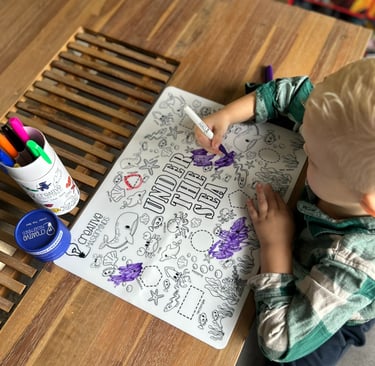 Non-toxic markers, eraser cloths, and storage tubes included with Scribbly Kids reusable drawing mat