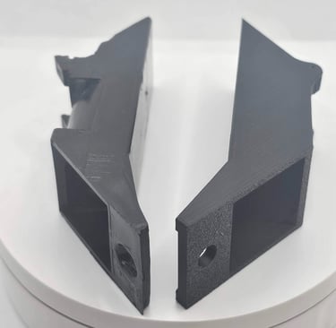 a pair of black and white plastic brackets
