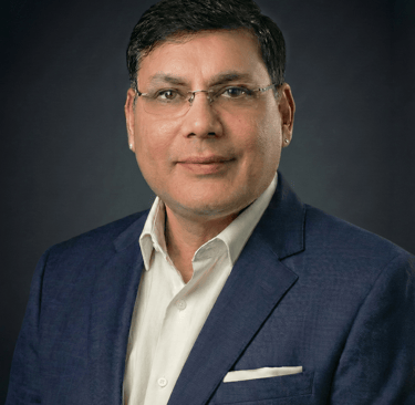 Portrait of Ruchir Saurabh, Senior Enterprise Leader, wearing professional business attire.