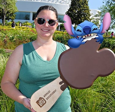 Katy Kaluzny pictured in front of Spaceship Earth at EPCOT®.