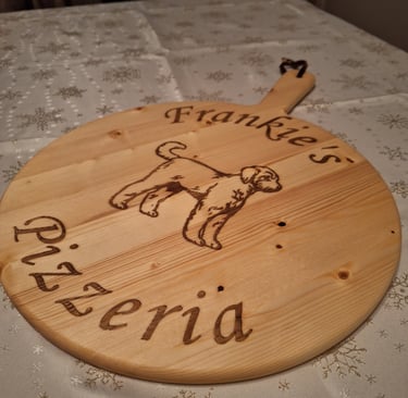 a wooden pizza board with a dog on it
