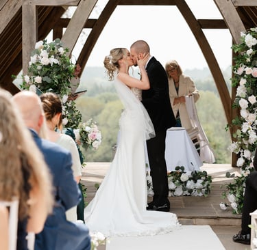 bride and groom first kiss at highley manor