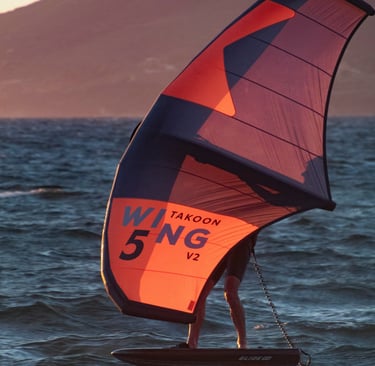 orange Wingfoil during sunset