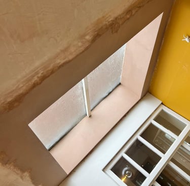 PLASTER BEEN APPLIED AROUND A WINDOW