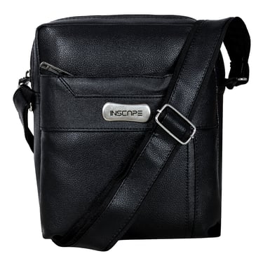 a black leather sling bag with a metal buckle