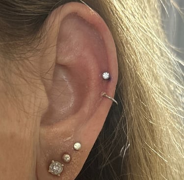 Fresh helix piercing fitted with safe titanium stud jewellery