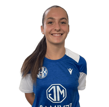 a woman in a blue shirt and black pants