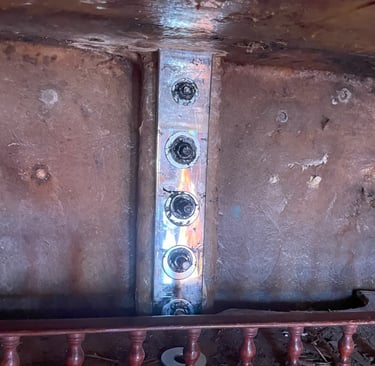 Newly mounted chainplate in sailboat showing clean installation