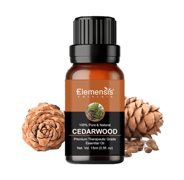 Cedarwood pinecones next to Cedarwood therapeutic grade essential oil bottle