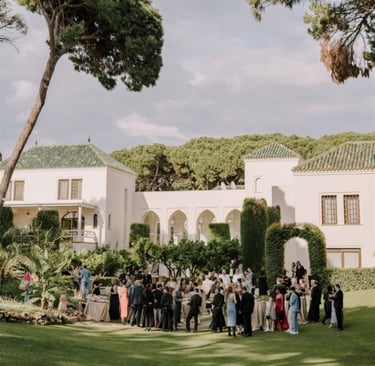 Garden event at Villa El Rincon with guests gathered among lush greenery