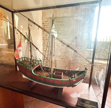 a boat in a glass case with a flag on it santo domingo punta cana