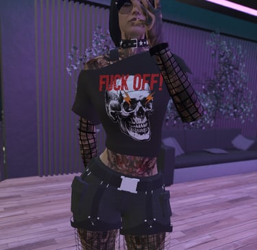 a top with a skull that says fuck off in red.